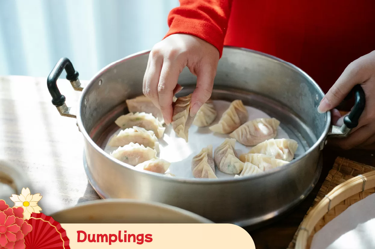 Preparing dumplings as a traditional Chinese New Year symbol of wealth and financial success for the Year of the Horse