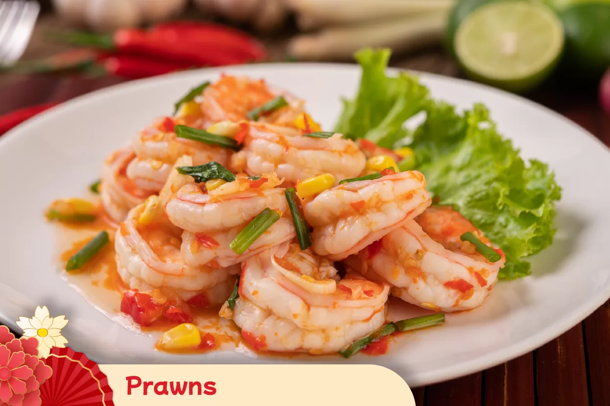 Serving vibrant prawns during Chinese New Year meals to represent a wish for a joyful year filled with laughter, vitality, and success